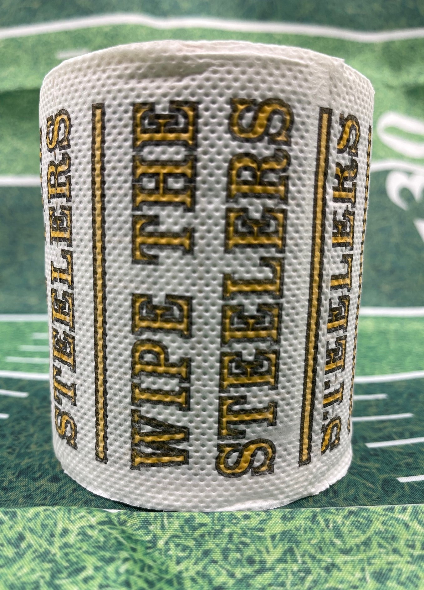 4 individually-wrapped “WIPE THE PACKERS” toilet paper.