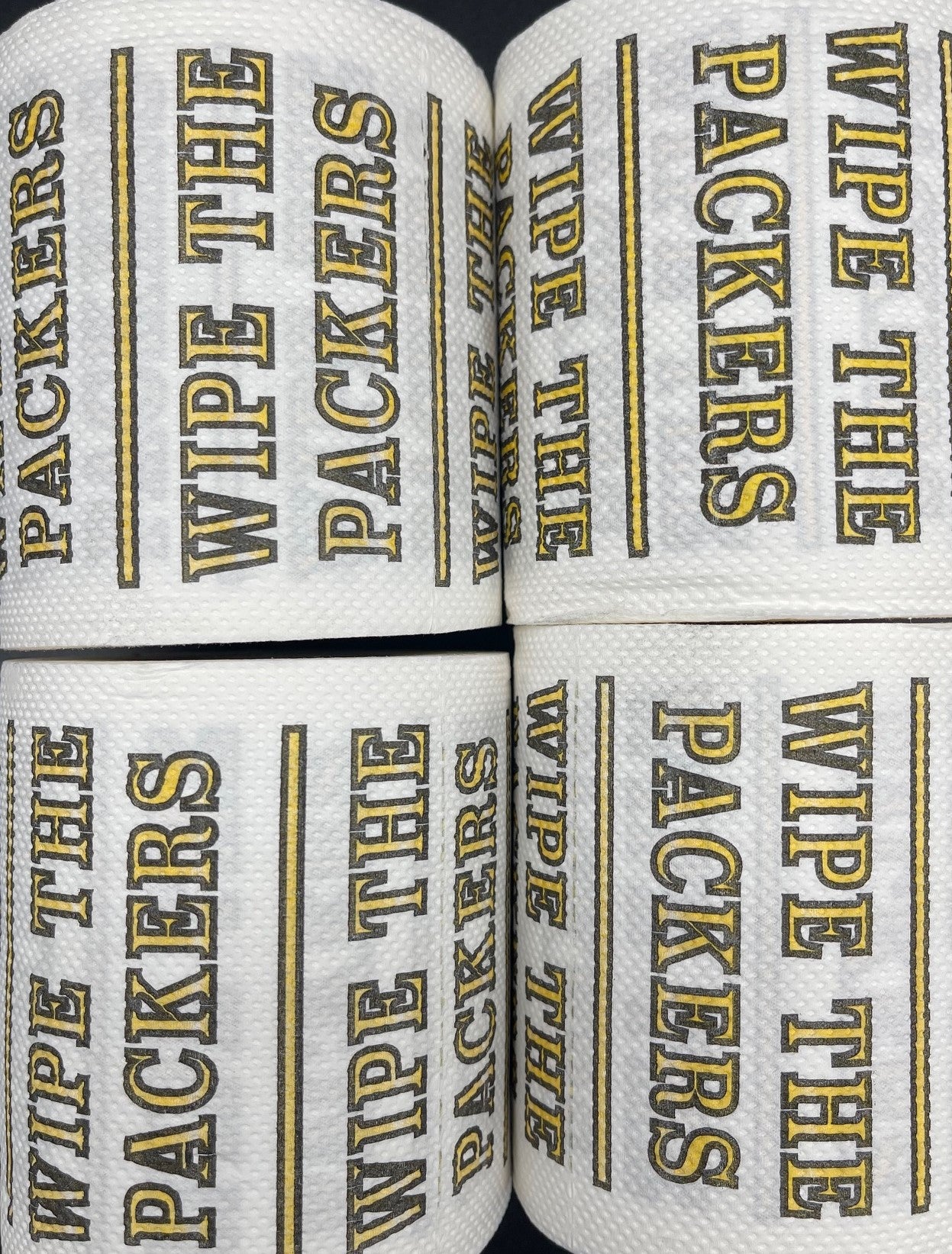 4 individually-wrapped “WIPE THE PACKERS” toilet paper.